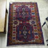 A Beluchi blue ground rug, 141cm x 90cm