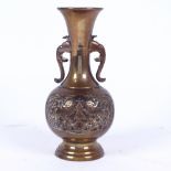 A small Chinese bronze narrow-neck vase, relief embossed Dog of Fo decoration, height 15cm
