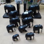 A pair of carved ebony elephant figures bookends, height 18cm, and 9 other ebony elephants
