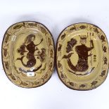 A pair of glazed pottery mermaid dishes, length 34cm