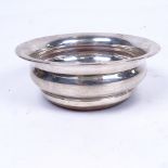 A silver and turned wood wine coaster, width 12.5cm