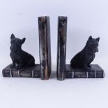 A pair of spelter bookends mounted with Terriers, height 17cm
