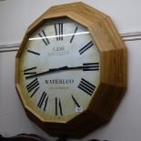 A reproduction pine-framed station clock, W70cm