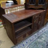 A Chinese hardwood design side cabinet, with relief carved panelled doors, on plinth base, W120cm,