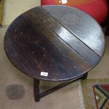 An Antique oak cricket table, W66cm, H57cm