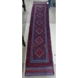 A Meshwani red ground runner, 262cm x 60cm