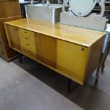 A mid-century teak and beech sideboard, with fitted drawers and cupboards, L151cm, H78cm, D47cm