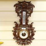 A Swiss carved oak-framed barometer and thermometer, by E Dietzsch of Zurich, height 46cm