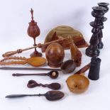 A collection of treen items, including a candle snuffer, a pair of candlesticks, 19cm, letter rack