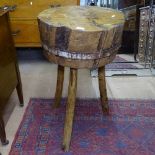 A 19th century Continental cherrywood chopping block, W50cm, H80cm