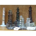 A collection of serpentine marble model lighthouses, including Penzance and Land's End, largest