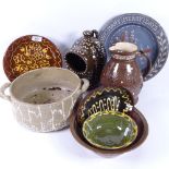 A quantity of slipware Studio pottery, including Heaven Send Thee Many Merry Days dish, jug, acorn