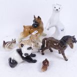 A group of mainly Russian and German ceramic animals, including a Russian white glaze stoat,