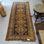 A blue ground Beluchi design runner, 175cm x 120cm