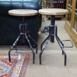 A pair of workroom adjustable stools, with hardwood seats