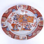 A Japanese Imari style oval porcelain plate with painted Samurai Warriors, 6 character mark, 31.