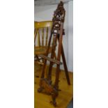 A table-top hardwood easel, with carved and pierced decoration, H97cm