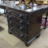 An Antique oak chest, with brushing slide, 4 long drawers under with lion mask handles, on bracket