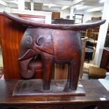 An Ashanti style stool with elephant support, W53cm, H52cm