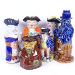 A group of 19th century English pottery Toby jugs, and a Fulham Pottery figural decanter, height