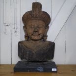 A Tibetan hardwood carved Buddha, H65cm