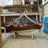 A large scratch-built dhow on stand, length 130cm