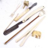 A 19th century carved bone spinning top, a pair of ivory glove stretchers, mother-of-pearl fork etc