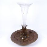 A large bronze copper and brass table centre trumpet epergne, with central etched fluted glass vase,