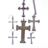Various silver and stone set crucifixes, including a pair of earrings