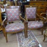 A pair of 19th century French open armchairs, on sabre legs