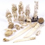 A collection of 19th century carved ivory okimono, letter openers, animals, and vegetable ivory (