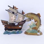 2 painted cast-iron doorstops, including ship and fish designs, largest height 28cm (2)