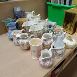 A group of decorative jugs, a Rheinware mug, 25cm, and a Clarice Cliff jam pot