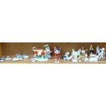 Various ceramic animal figures, including cow creamer, cow parade beefeater etc