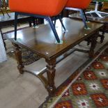 A 1920s oak rectangular draw leaf dining table, L160cm extending to 260cm, H73cm, D95cm