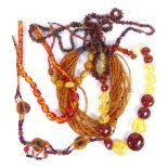 A multi-strand amber string necklace, and other amber bead necklaces