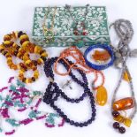 A mother-of-pearl decorated jewellery box, amethyst and stone set necklaces, coral necklace etc