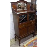 A Globe-Wernicke oak 4-section bookcase, with lead-light glazed doors and drawer fitted base, W87cm,