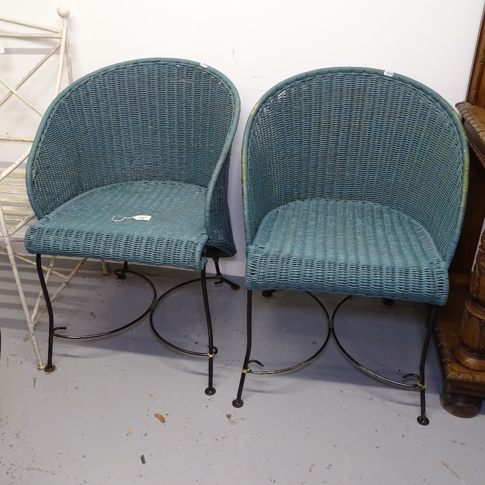 A pair of art deco style painted wicker garden tub chairs, on scrolled wrought-iron legs