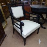 A late Victorian Aesthetic Movement ebonised armchair, in the manner of E W Godwin