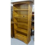 A modern polished pine 5-tier open bookcase, W92cm