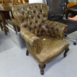 An early 20th century button-back leather upholstered armchair, on cabriole legs