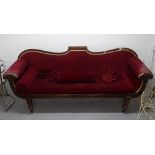 A Regency mahogany-framed salon settee, with carved Prince of Wales Feather decoration, on turned