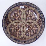 A hand painted and glazed pottery bowl, possibly Islamic, diameter 36cm