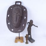 A bronze sculpture by John Riddock?, height 31.5cm, an Ivory Coast Bantu Tribal mask on plinth,