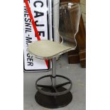 A modernist design metal and Lucite swivel chair