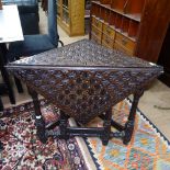 An Antique oak triangular single drop leaf table, with allover chip carved decoration, W82cm, H69cm