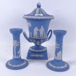 A Wedgwood Jasperware urn and cover, 30.5cm, and a pair of matching candlesticks