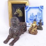 A cast-iron Sphinx, a Delft tile, 2 Buddhas etc