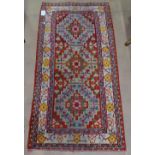 A red ground Bokora design rug, 160cm x 78cm